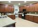 Well-equipped kitchen with ample cabinet space, tile backsplash, and stainless steel appliances, perfect for cooking at 1126 Woodlands Creek Way, Apex, NC 27502