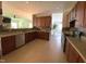Open kitchen with tiled floors, updated countertops, and stainless steel appliances at 1126 Woodlands Creek Way, Apex, NC 27502