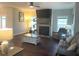 Spacious living room with fireplace and hardwood floors at 1126 Woodlands Creek Way, Apex, NC 27502