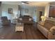 Living room with hardwood floors, fireplace and ample seating at 1126 Woodlands Creek Way, Apex, NC 27502
