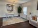 Living room featuring an accent rug and lots of natural light at 1126 Woodlands Creek Way, Apex, NC 27502