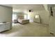 Bright main bedroom featuring a tray ceiling, carpet, and coordinated furniture at 1126 Woodlands Creek Way, Apex, NC 27502
