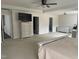 Spacious main bedroom with tray ceiling, en suite bathroom, and ample space at 1126 Woodlands Creek Way, Apex, NC 27502