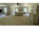 Spacious main bedroom with tray ceiling, carpet, and bright, natural light at 1126 Woodlands Creek Way, Apex, NC 27502