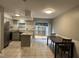 Open kitchen with granite countertops, stainless steel appliances, and an adjacent dining area at 1136 Nottingham Cir, Cary, NC 27511