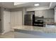 Open kitchen featuring granite countertops, stainless steel appliances, and tile backsplash at 1136 Nottingham Cir, Cary, NC 27511