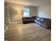 Spacious living room with hardwood floors, natural light, and a comfortable sectional sofa at 1136 Nottingham Cir, Cary, NC 27511