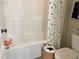 Well-lit tub/shower featuring modern fixtures and charming decorative accents at 120 Glen Oaks Dr, Youngsville, NC 27596