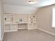 Bedroom featuring built-in shelving and desk space, offering functionality and style at 120 Glen Oaks Dr, Youngsville, NC 27596