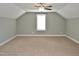 Spacious room with carpet, ceiling fan, and a window for natural light at 120 Glen Oaks Dr, Youngsville, NC 27596