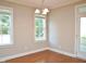 Cozy dining area with hardwood floors, abundant natural light, and access to the backyard at 120 Glen Oaks Dr, Youngsville, NC 27596