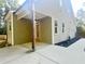 Side view showcasing the home's architecture, covered porch and ample parking space at 120 Glen Oaks Dr, Youngsville, NC 27596
