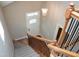 Staircase leading to a white door, natural lighting, and modern railings at 120 Glen Oaks Dr, Youngsville, NC 27596