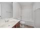 Bathroom with a large white vanity and tub with shower at 125 Brook Pl, Smithfield, NC 27577