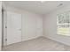 Bedroom with neutral walls and gray carpet at 125 Brook Pl, Smithfield, NC 27577