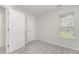 Bright bedroom features neutral walls, plush carpeting, and a window with natural light at 125 Brook Pl, Smithfield, NC 27577