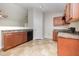 Kitchen area with wood cabinets, black appliances, and neutral flooring at 125 Brook Pl, Smithfield, NC 27577