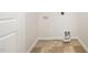 Spacious laundry room with tiled flooring and connections for a washer and dryer at 125 Brook Pl, Smithfield, NC 27577