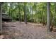 Backyard with wooded, sloping lot at 127 Creekwood, Pittsboro, NC 27312
