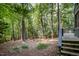 Wooded backyard featuring stairs and decking at 127 Creekwood, Pittsboro, NC 27312