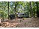 Back exterior view of the home and the lush wooded lot at 127 Creekwood, Pittsboro, NC 27312