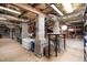 Unfinished basement with cement foundation and exposed utilities at 127 Creekwood, Pittsboro, NC 27312