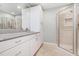 Bathroom showcasing granite countertop, white cabinetry, and a glass shower at 127 Creekwood, Pittsboro, NC 27312