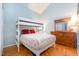 Bedroom with hardwood floors, a bunk bed, and bright light coming from the window at 127 Creekwood, Pittsboro, NC 27312