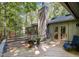 Deck of home with chairs and flower pots at 127 Creekwood, Pittsboro, NC 27312