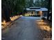 View of home at night with illuminated driveway at 127 Creekwood, Pittsboro, NC 27312