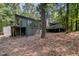 Exterior of home featuring a walkout basement, deck and large windows at 127 Creekwood, Pittsboro, NC 27312