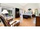 Spacious main bedroom featuring parquet floors, a vaulted ceiling, and a sitting area at 127 Creekwood, Pittsboro, NC 27312