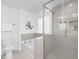 Modern bathroom with separate tub and shower, featuring neutral colored tiling at 130 Summer Mist Ln # 160, Clayton, NC 27527