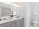 Well-lit bathroom featuring a double sink vanity, a large mirror, and neutral colored walls at 130 Summer Mist Ln # 160, Clayton, NC 27527