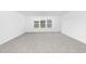 Spacious bedroom featuring plush carpeting, recessed lighting, and a large window with neighborhood views at 130 Summer Mist Ln # 160, Clayton, NC 27527