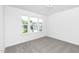Carpeted bedroom featuring recessed lights, a window and white walls at 130 Summer Mist Ln # 160, Clayton, NC 27527