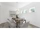 Bright dining room with modern chandelier, seating for six, and white walls at 130 Summer Mist Ln # 160, Clayton, NC 27527