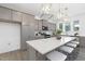 Open kitchen featuring a large island with seating, quartz countertops, and stainless steel appliances at 130 Summer Mist Ln # 160, Clayton, NC 27527