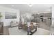 Open concept living and kitchen area with stylish gray cabinets and ample natural light at 130 Summer Mist Ln # 160, Clayton, NC 27527