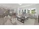 Open concept living space with a modern kitchen featuring stainless steel appliances and bar seating at 130 Summer Mist Ln # 160, Clayton, NC 27527