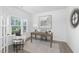 Well-lit home office with a classic wooden desk and view to a landscaped yard at 130 Summer Mist Ln # 160, Clayton, NC 27527