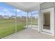 Screened porch with views of green space and houses at 130 Summer Mist Ln # 160, Clayton, NC 27527