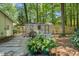 Charming backyard shed complete with hot tub and manicured landscaping at 1317 Elmset Ln, Durham, NC 27713