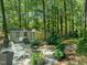 Backyard featuring a shed, hot tub, patio, fire pit and seating area at 1317 Elmset Ln, Durham, NC 27713