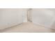 Neutral bedroom with plush carpet, closet, and ample electrical outlets at 1317 Elmset Ln, Durham, NC 27713