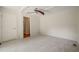 Bedroom with neutral tones, white doors, and plush carpeting at 1317 Elmset Ln, Durham, NC 27713