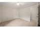 Spacious bedroom with ceiling fan, closet, and access to the en suite bathroom at 1317 Elmset Ln, Durham, NC 27713