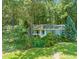 Aerial view of home with a spacious front yard and mature trees at 1317 Elmset Ln, Durham, NC 27713