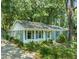 Well-maintained home with charming exterior, landscaping, and a paved driveway at 1317 Elmset Ln, Durham, NC 27713