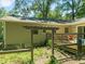 Exterior of home with a deck, outdoor seating, and a pergola at 1317 Elmset Ln, Durham, NC 27713